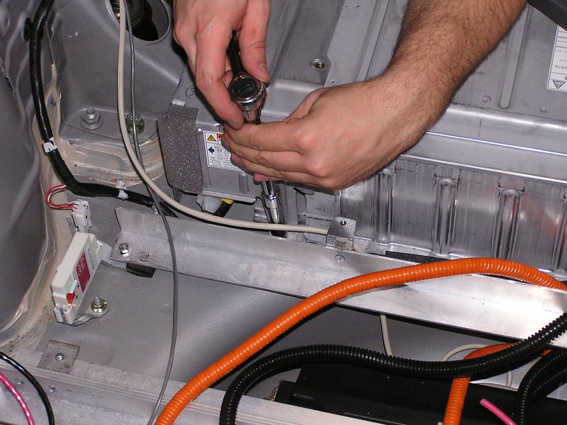 File:Opening OEM battery.jpg