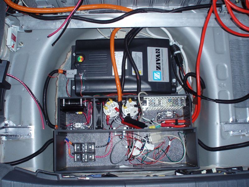 File:Electronics Box And Charger in Tire Well.jpg